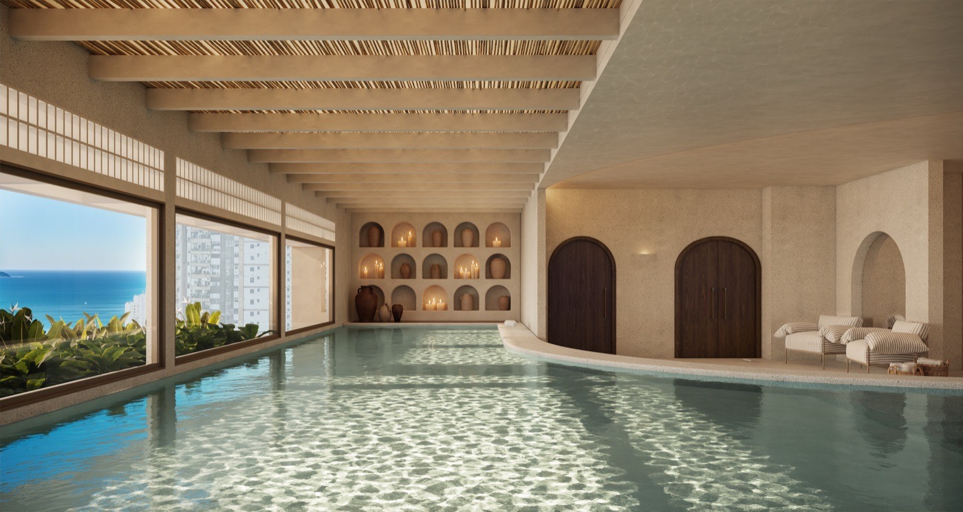 Piscina interna do Kronos, com arcos de inspiração grega, vista através do símbolo da JTavares
