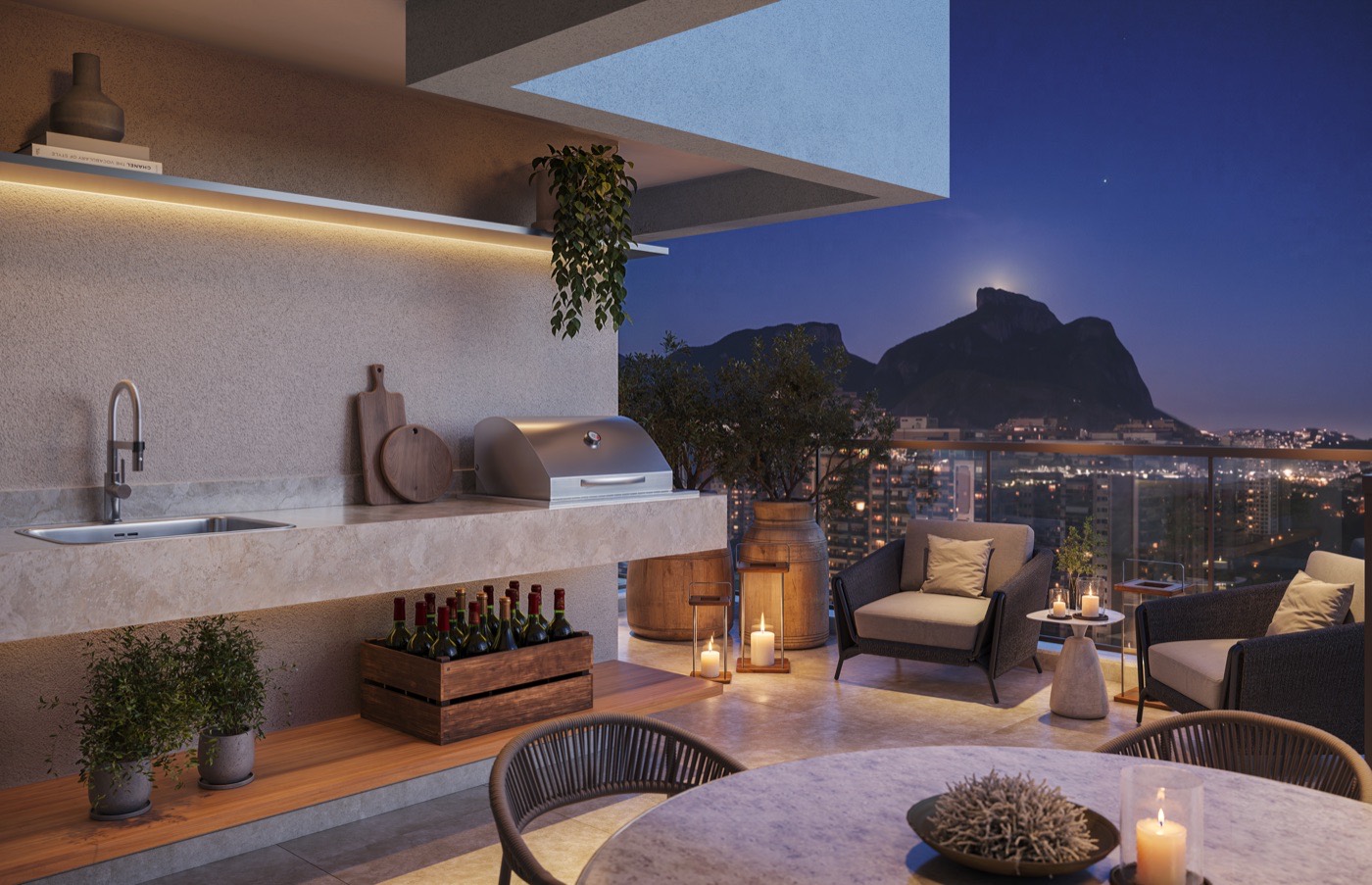Varanda gourmet de cobertura à noite com vista da Pedra da Gávea